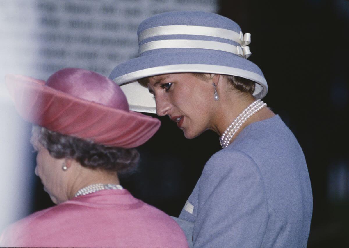 Queen Elizabeth II and Princess Diana attending the wedding of Viscount Linley and Serena Stanhope (circa 1993)