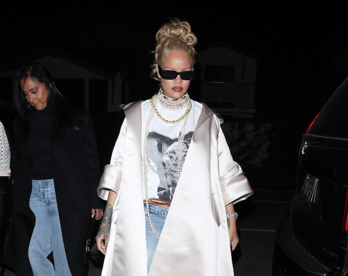 Singer Rihanna wears pearl necklaces and baggy jeans with blonde hair as she enters a restaurant in Santa Monica