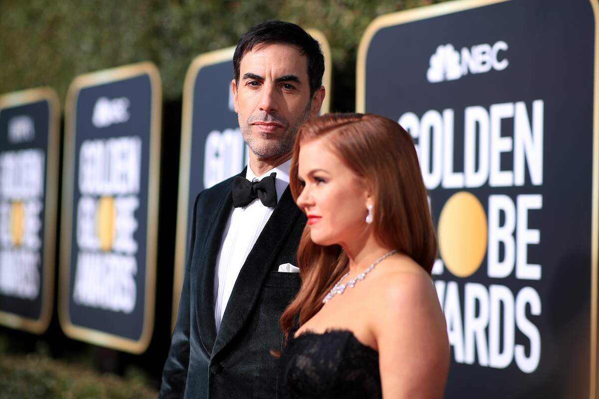 Married couple Sacha Baron Cohen and Isla Fisher wear formal outfits on the red carpet of the 76th Annual Golden Globe Awards