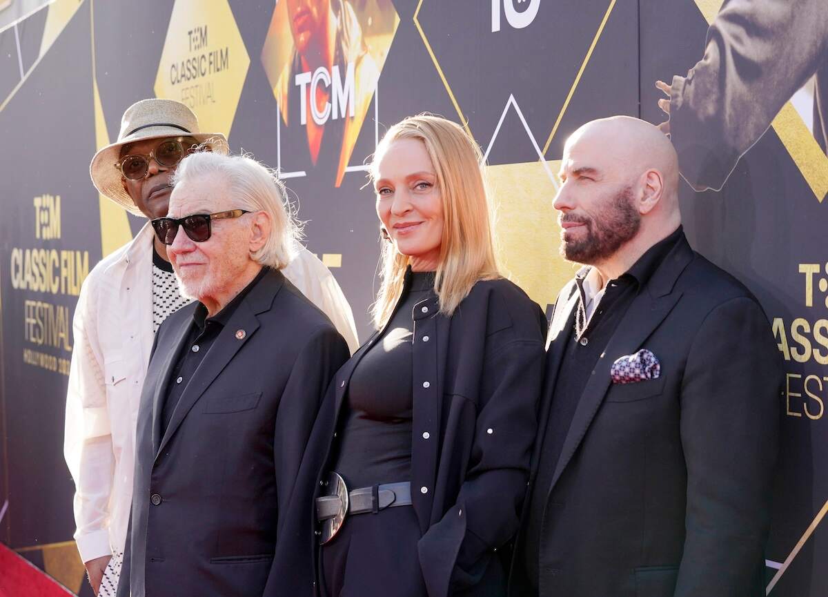 Pulp Fiction cast members Samuel L. Jackson, Harvey Keitel, Uma Thurman, and John Travolta pose for photos on the red carpet at the Opening Night Gala and 30th Anniversary Screening