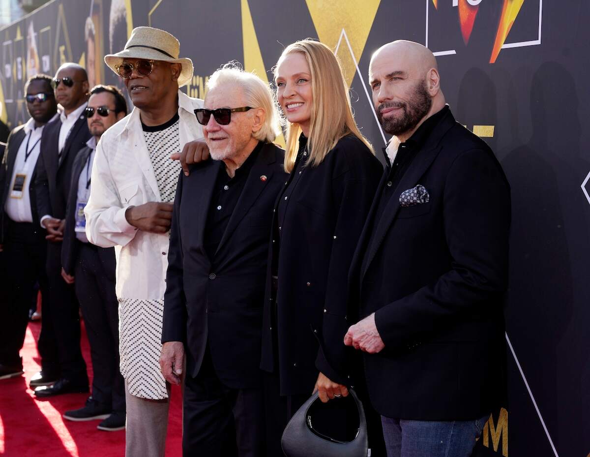 Pulp Fiction cast members Samuel L. Jackson, Harvey Keitel, Uma Thurman, and John Travolta pose for photos on the red carpet at the Opening Night Gala and 30th Anniversary Screening