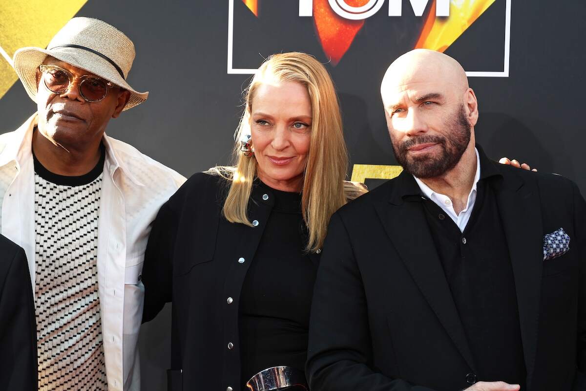Pulp Fiction cast members Samuel L. Jackson, Uma Thurman, and John Travolta pose for photos on the red carpet at the Opening Night Gala and 30th Anniversary Screening