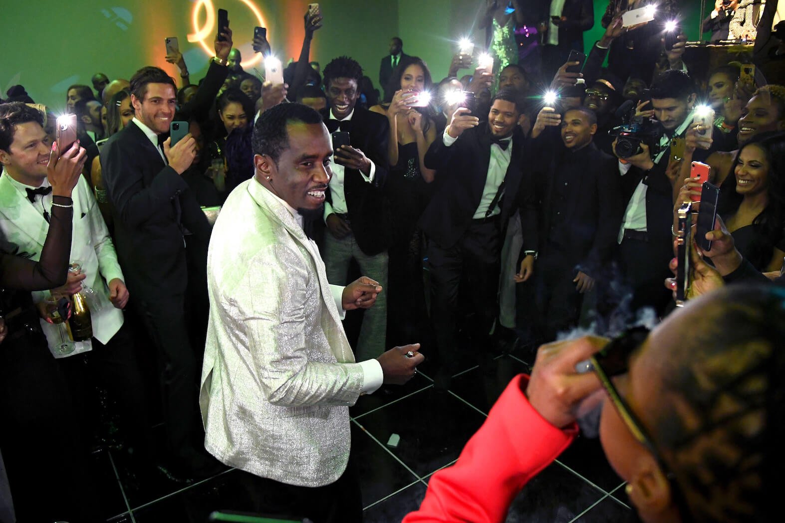 Sean 'P. Diddy' Combs dancing at his 50th birthday bash while surrounded by celebrities