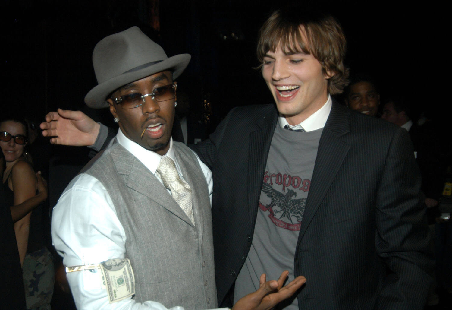 Sean 'P. Diddy' Combs and Ashton Kutcher laughing in 2003