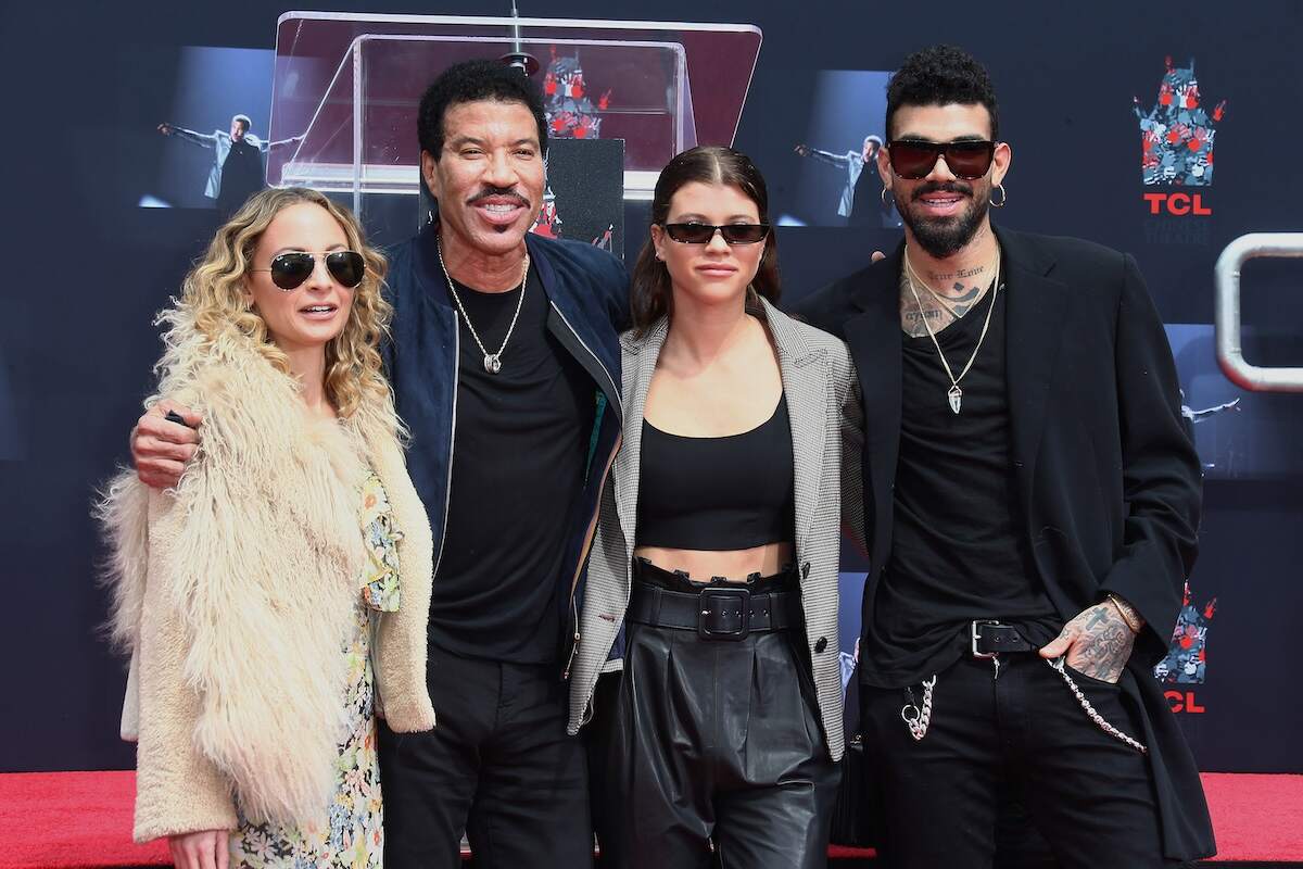 The Richie family, Nicole Richie, Lionel Richie, Sofia Richie, and Miles Richie, pose together on the red carpet at the Lionel Richie Hand And Footprint Ceremony