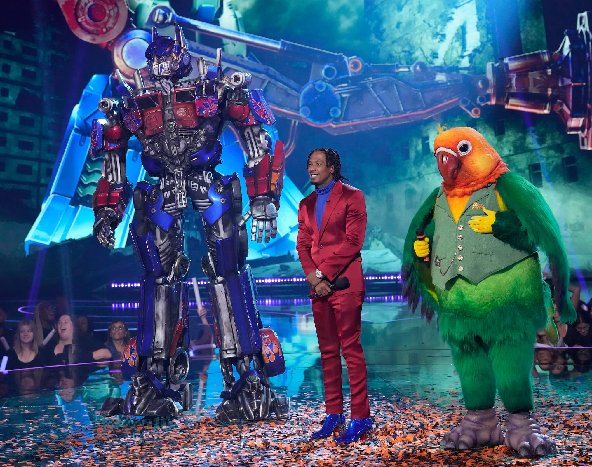 Optimus Prime, Nick Cannon, and Lovebird on 'The Masked Singer' Season 11 Transformers Night