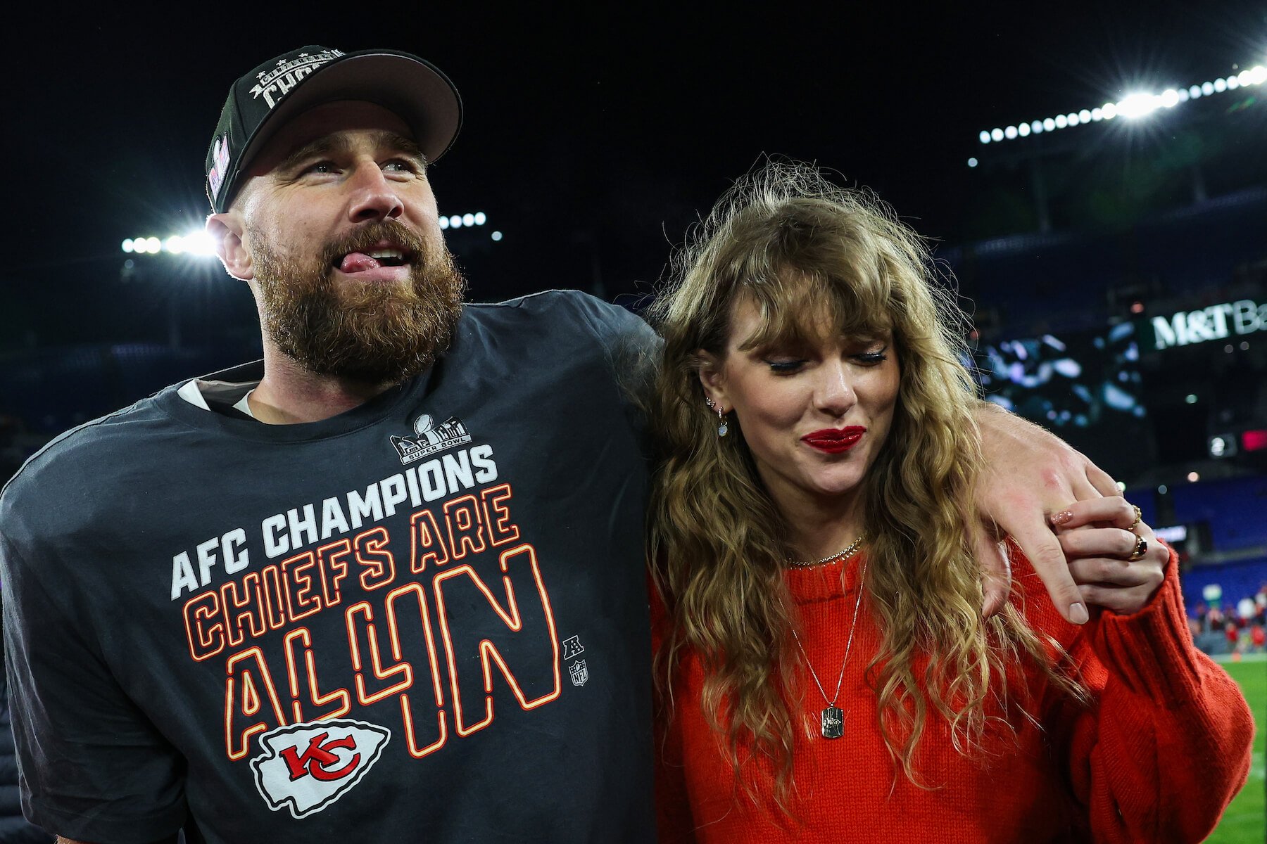 Travis Kelce with his arm around Taylor Swift after a football game with the Kansas City Chiefs