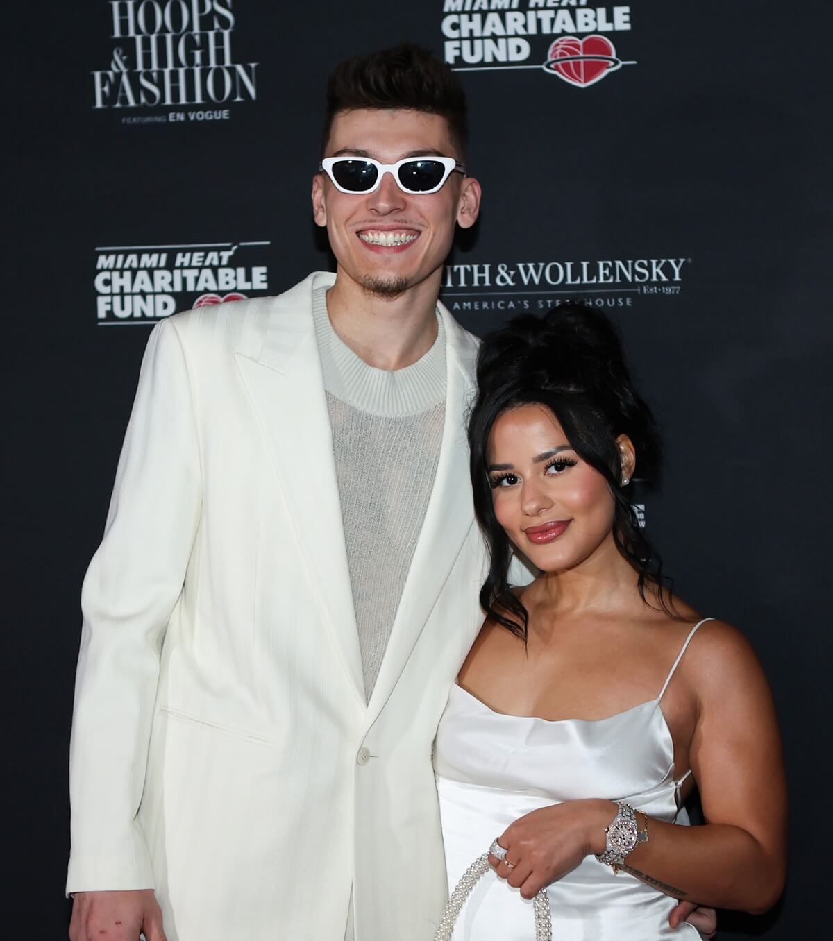 Tyler Herro of the Miami Heat and Katya Elise Henry pose for a photo on the red carpet prior to the 14th Annual Miami HEAT Gala
