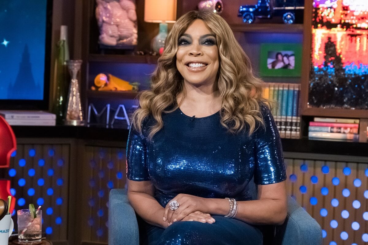 Wendy Williams sitting on a chair in a blue dress on an episode of 'Watch What Happens Live with Andy Cohen'.
