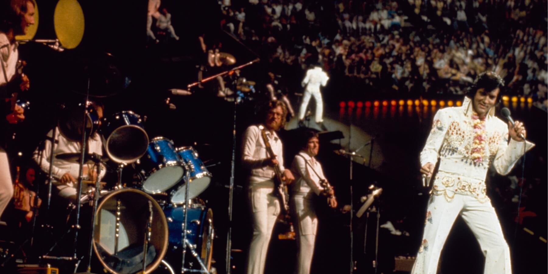 Elvis Presley and the TCB band photographed in 1973.