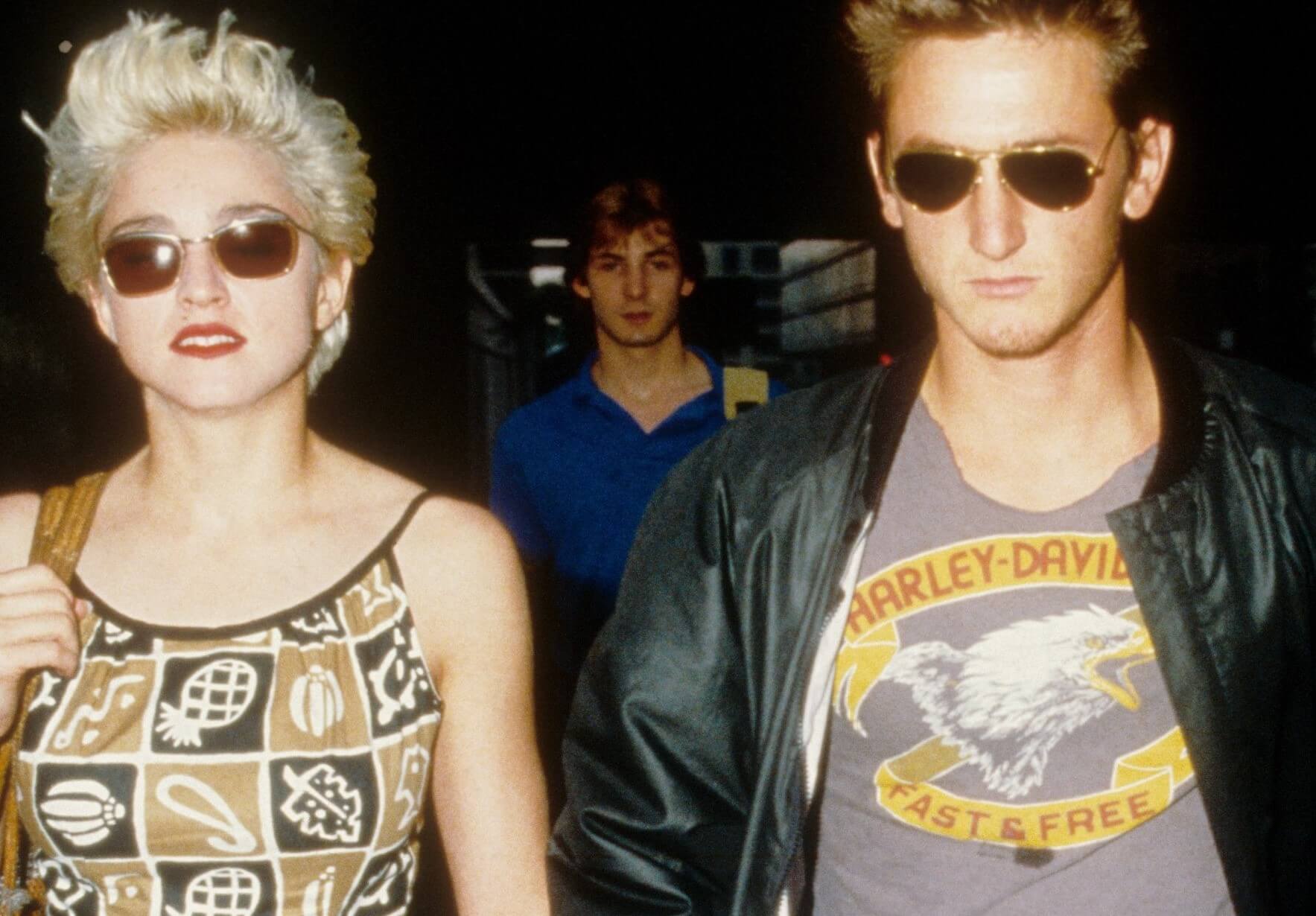 Madonna and Sean Penn wearing sunglasses