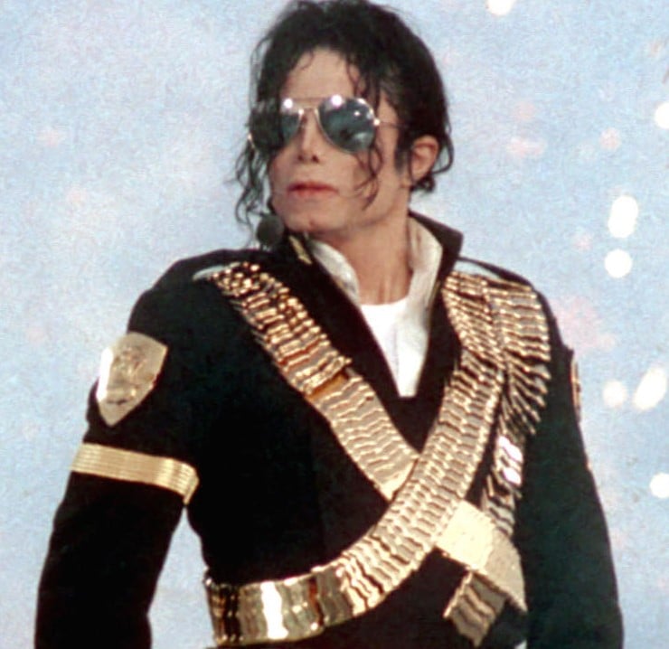 Michael Jackson wearing a gold sash
