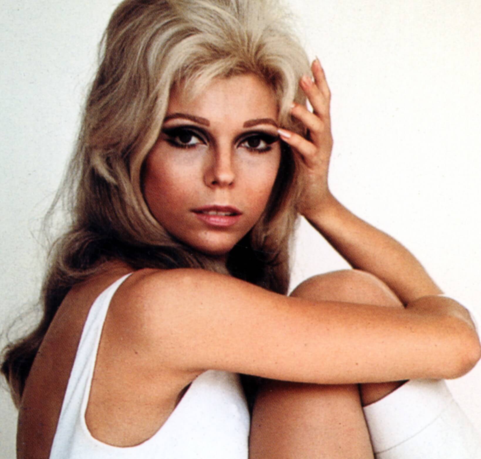 "These Boots Are Made for Walkin'" singer Nancy Sinatra wearing white