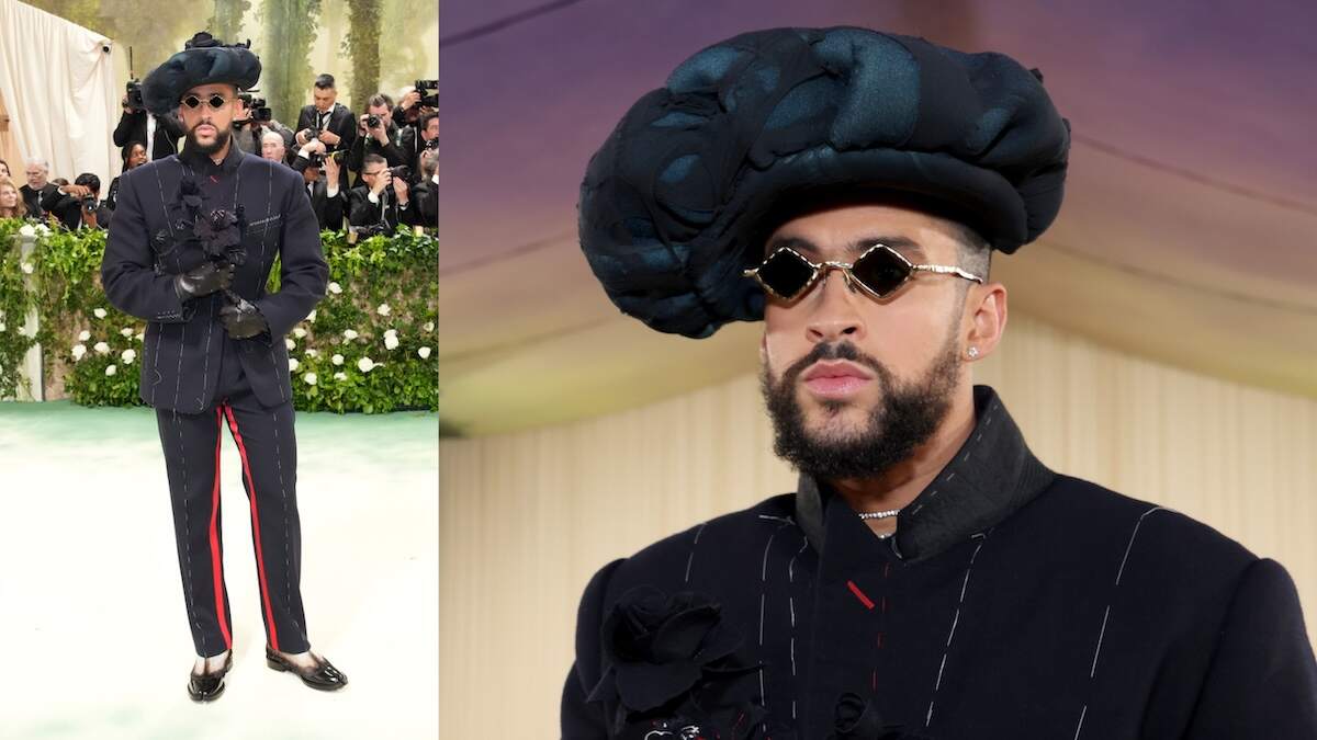 Rapper Bad Bunny wears a black suit and hat and walks the red carpet at the 2024 Met Gala