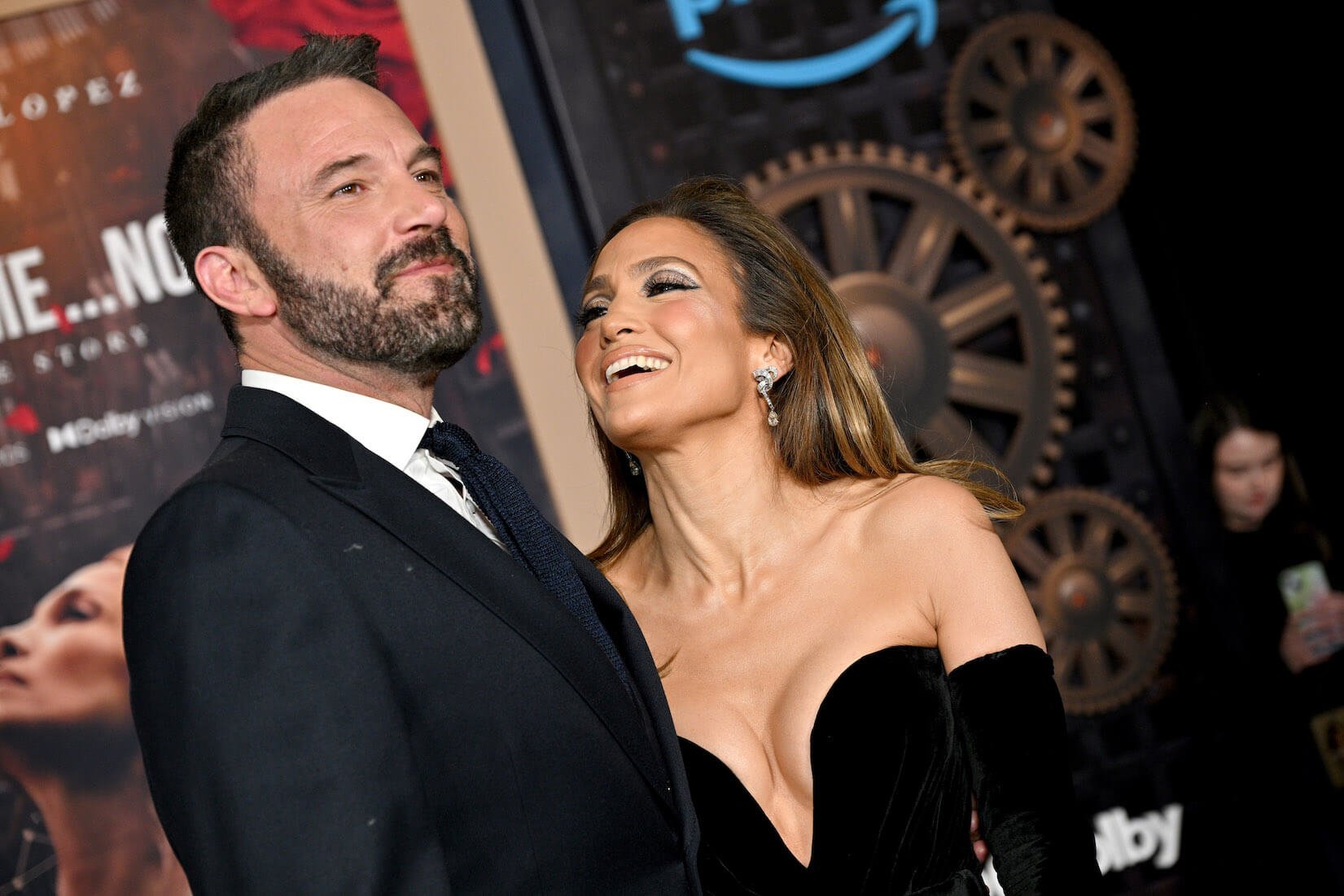 Jennifer Lopez smiling and looking up at Ben Affleck at the premiere of 'This Is Me ... Now: A Love Story' in February 2024