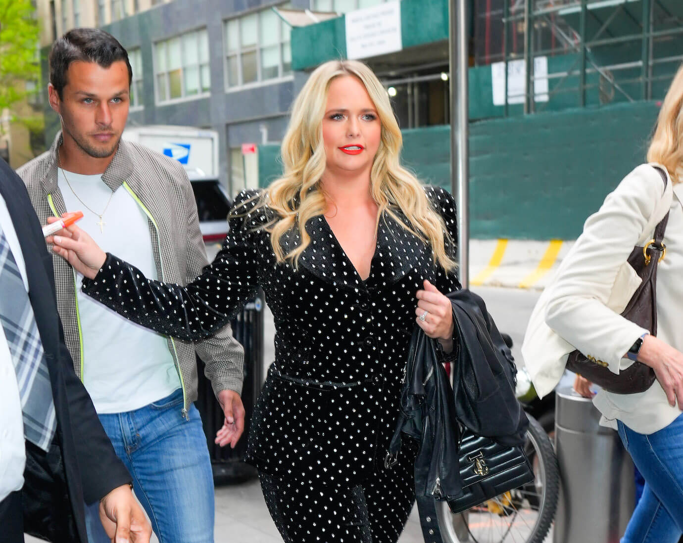 Miranda Lambert walking in front of her husband, Brendan McLoughlin, in New York City in 2023