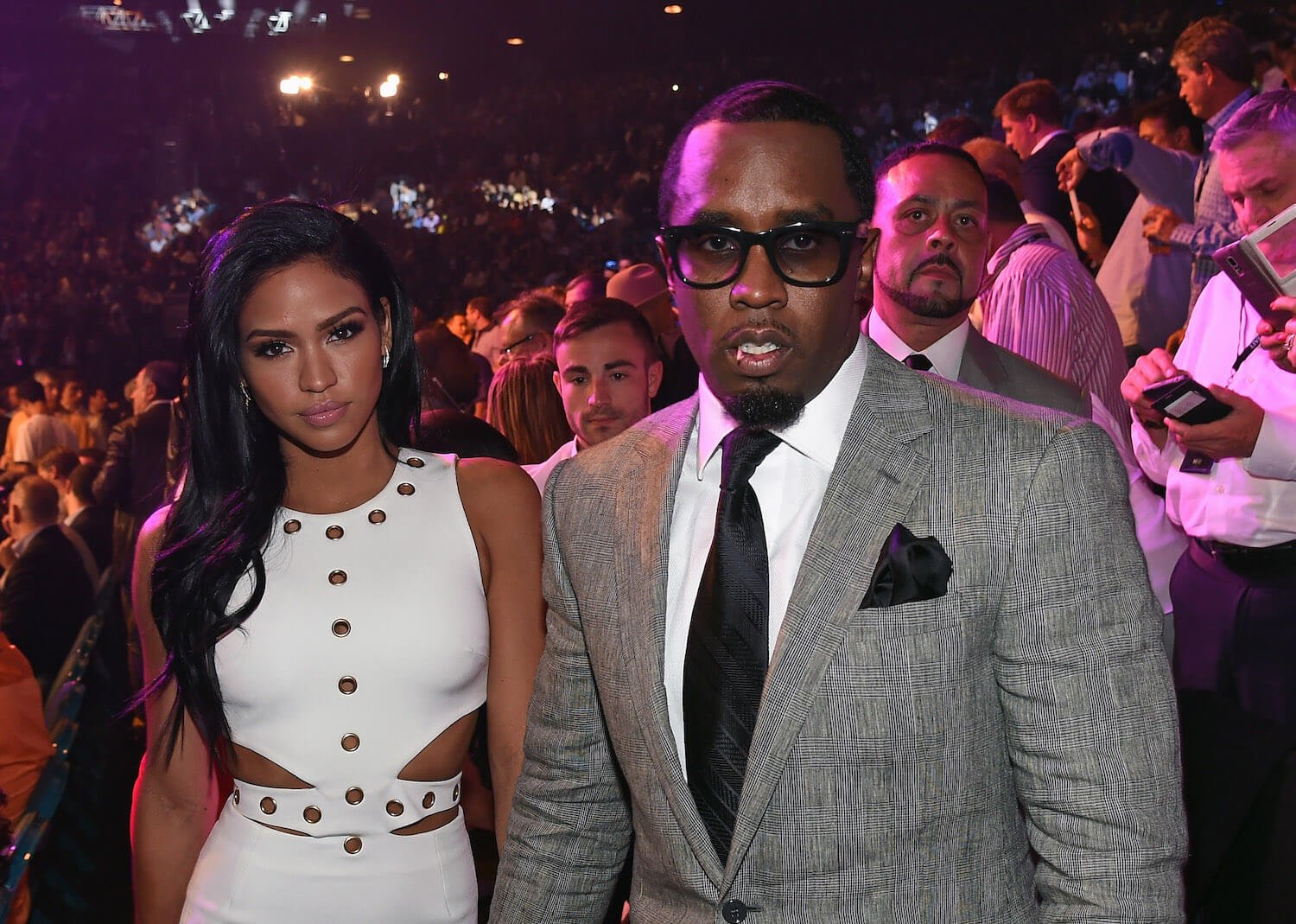 Casandra 'Cassie' Ventura and Sean 'P. Diddy' Combs in 2015 in a crowd bathed in pink light