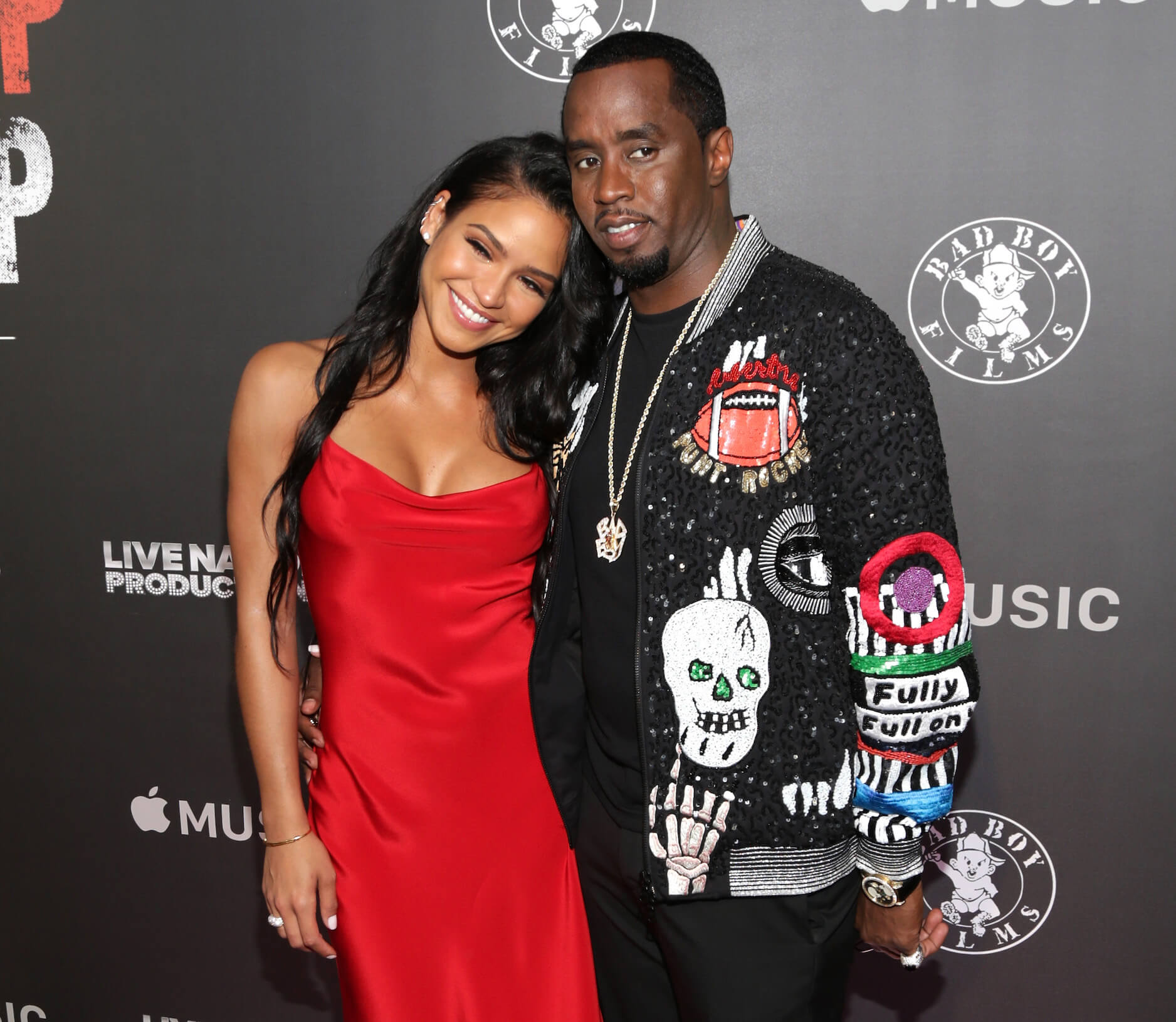 Casandra 'Cassie' Ventura smiling with her head on Sean 'P. Diddy' Combs' shoulder at an event