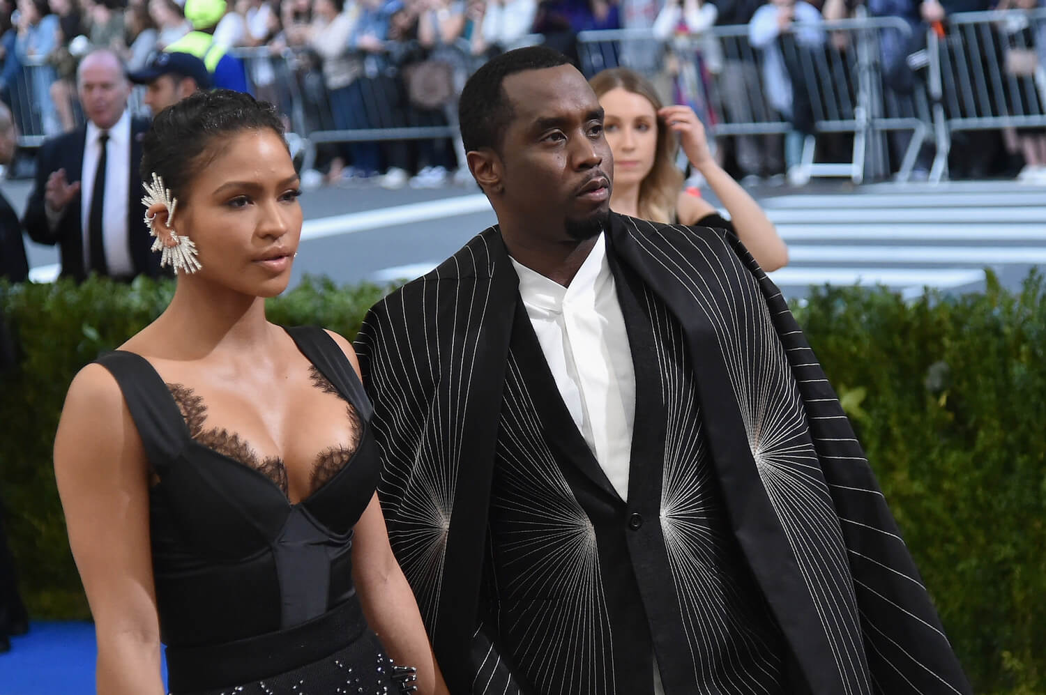 Casandra 'Cassie' Ventura standing next to Sean 'P. Diddy' Combs at the Met Gala in 2017. They are dressed in black.