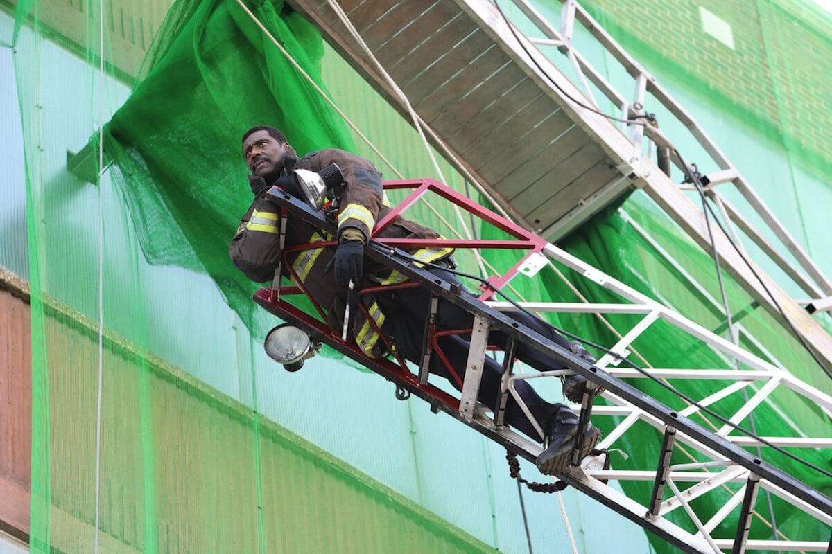 Low-angle view of Wallace Boden on a firetruck ladder from 'Chicago Fire' Season 12 finale