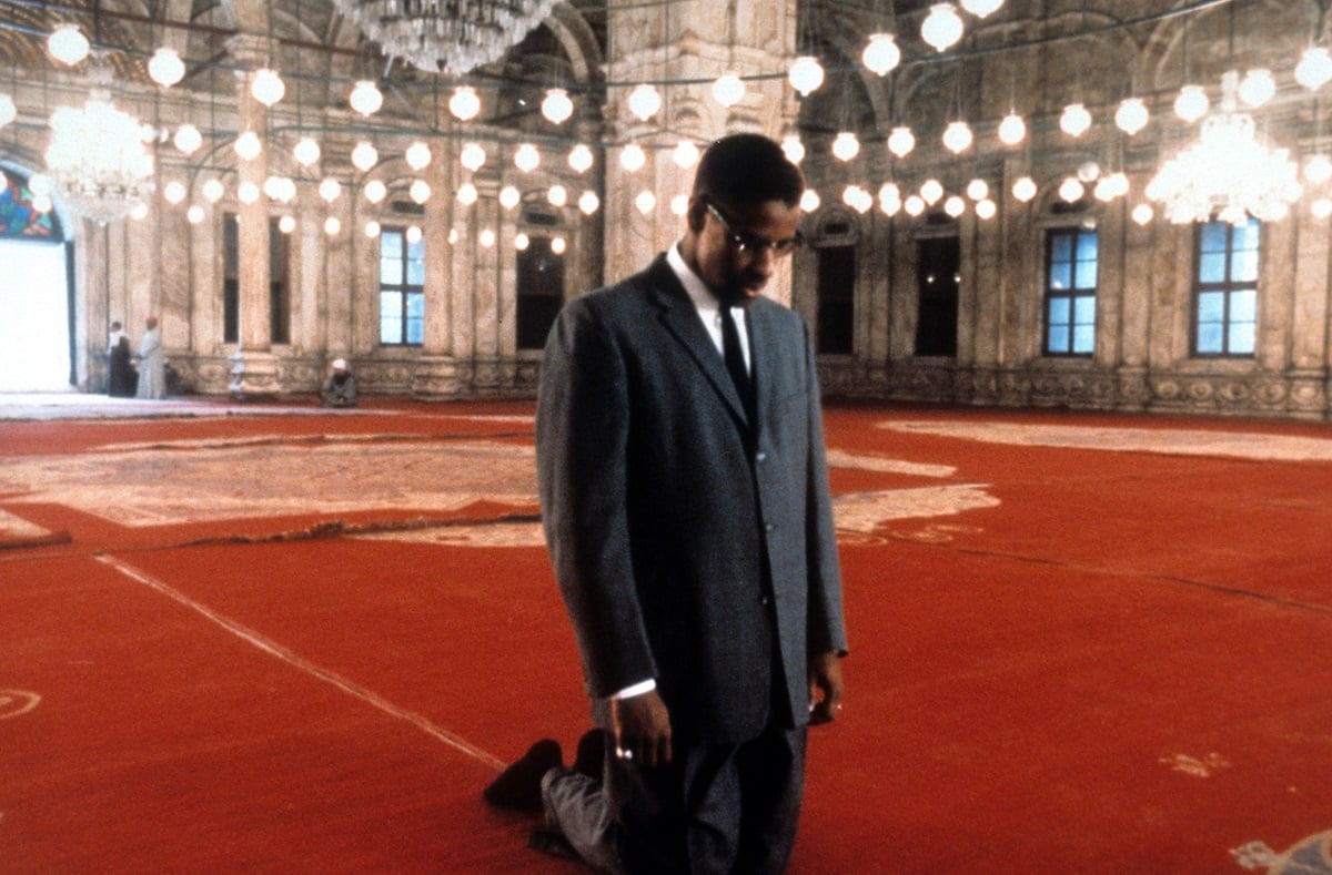Denzel Washington posing as Malcolm X.