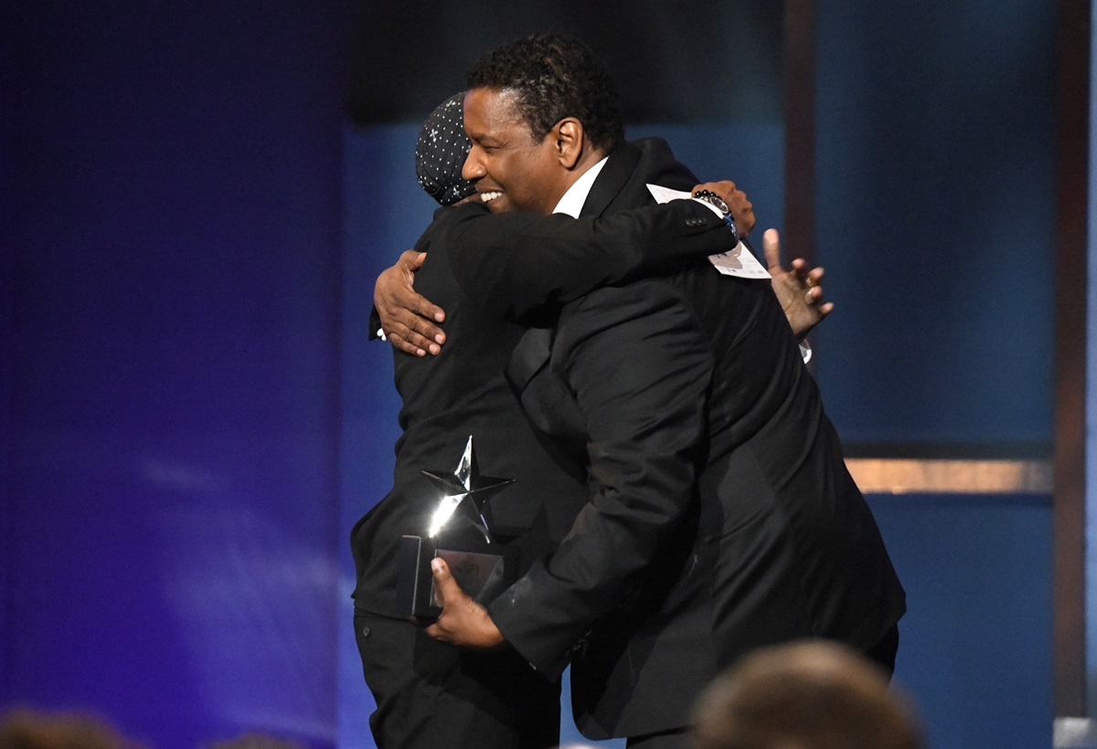 Denzel Washington and Spike Lee hugging each other at the AFI Awards.