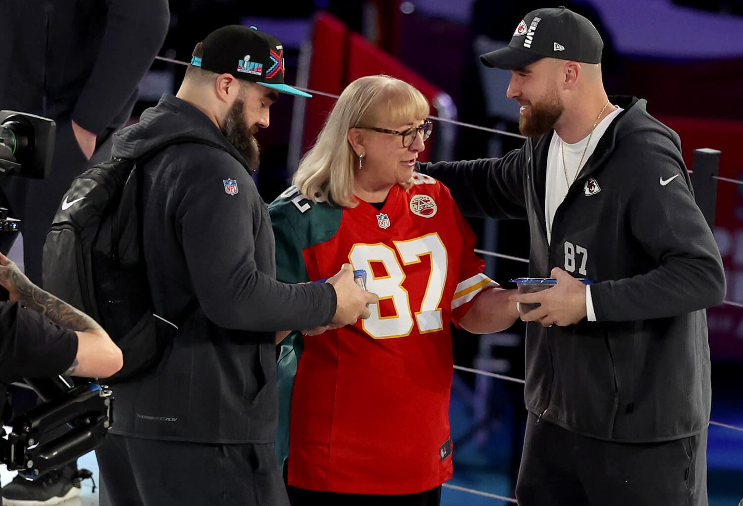 Donna Kelce in the middle of Jason and Travis Kelce during Super Bowl LVII