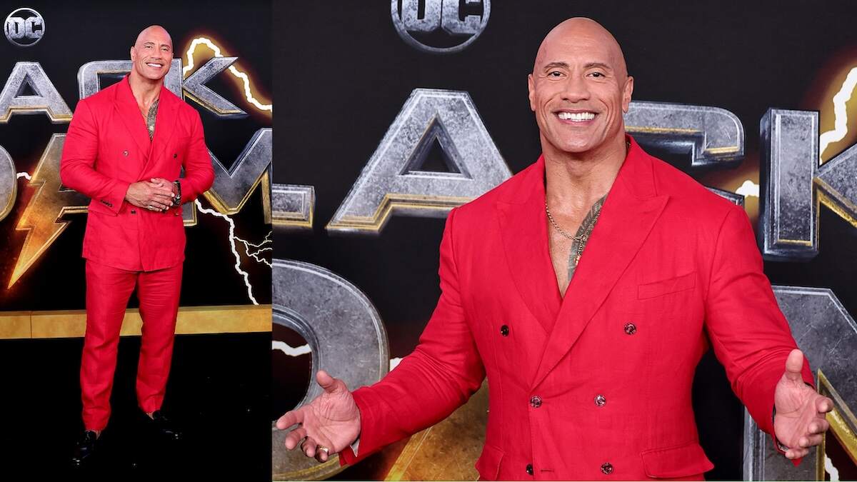 Wearing a red suit, Dwayne Johnson walks the red carpet at the Black Adam premiere