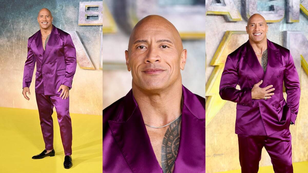 Wearing a purple suit, Dwayne Johnson walks the red carpet at the Black Adam premiere