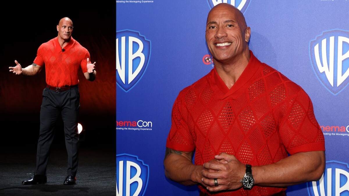 Wearing a black pants and a red mesh polo shirt, Dwayne Johnson speaks to an audience and CinemaCon