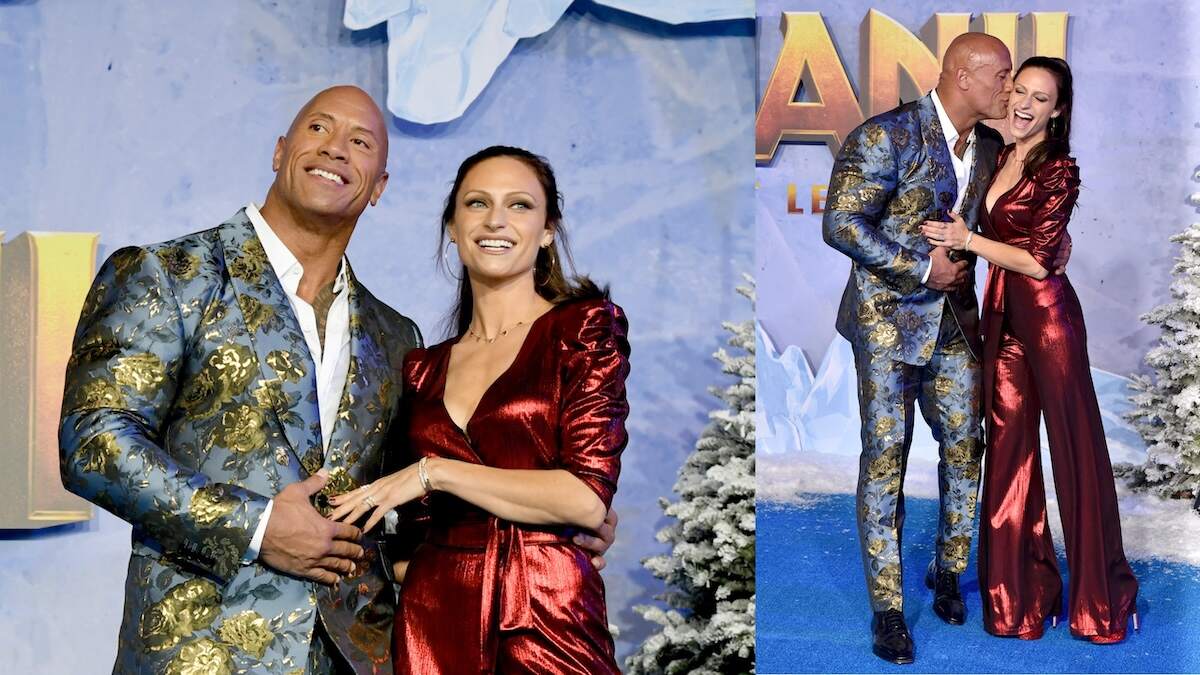 Wearing a blue and yellow floral suit, Dwayne Johnson walks the red carpet at the Jumanji premiere