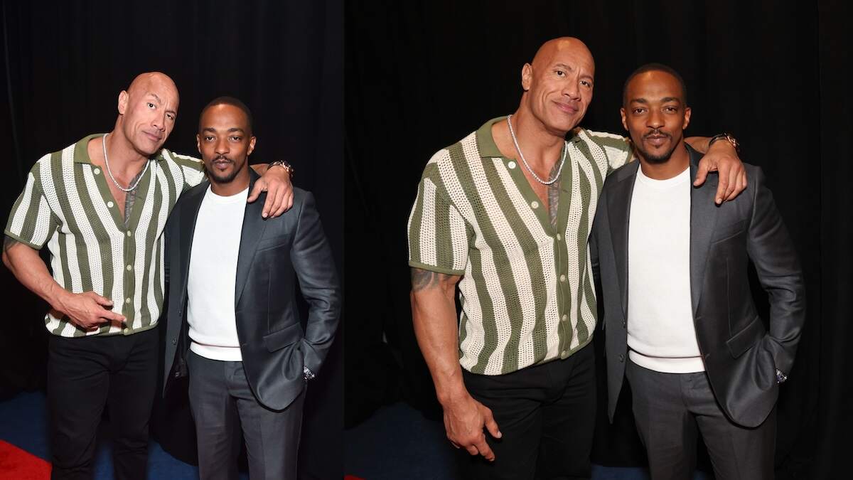 Wearing a green and white crochet top, Dwayne Johnson poses with a friend