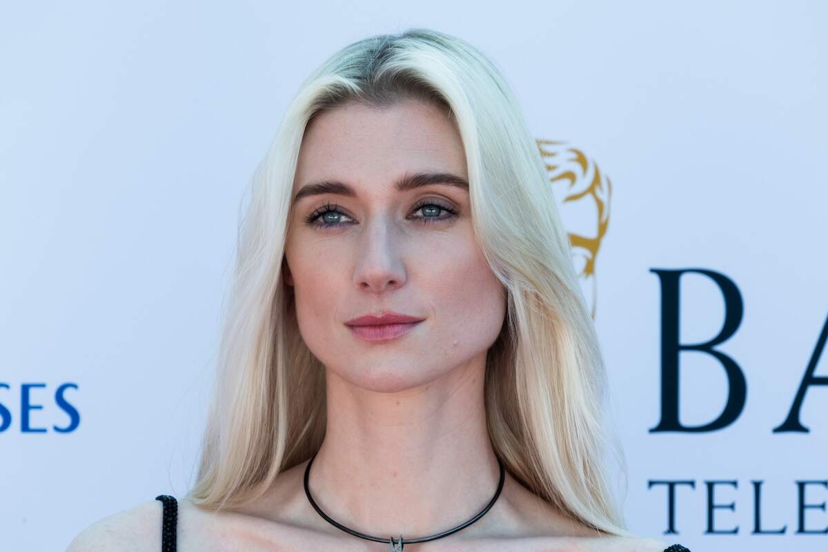 Actor Elizabeth Debicki wears a black dress and diamond necklace on the red carpet at the 2024 BAFTA Television Awards