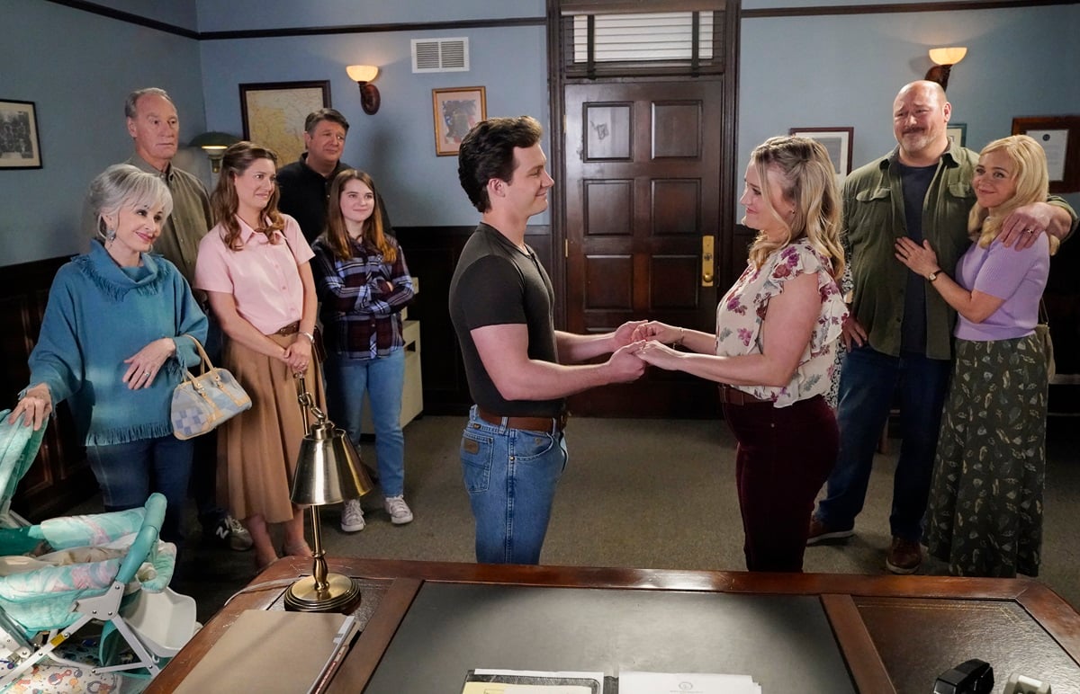 Georgie and Mandy get married in an episode of 'Young Sheldon.' The Cooper family looks on.