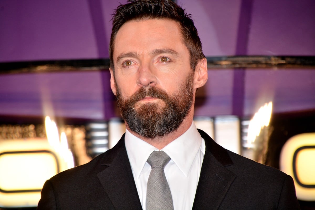 Hugh Jackman posing in a suit at the premiere of 'X-Men Days of Future Past'.