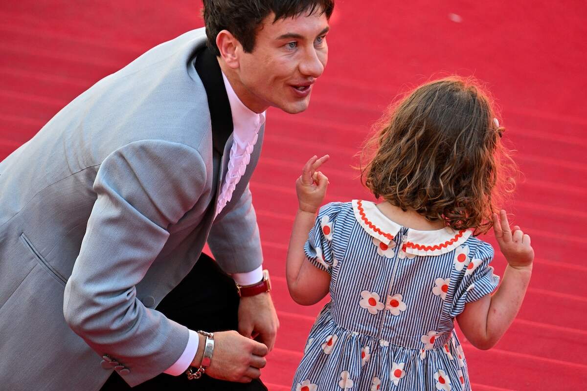 Actors Barry Keoghan and Jackie Mellor talk together on the red carpet at the 77th edition of the Cannes Film Festival