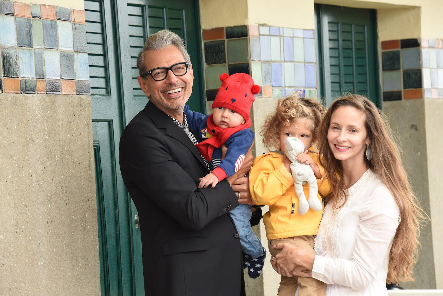 Jeff Goldblum smiling with wife, Emilie Livingston, and their children, River Joe Goldblum and Charlie Ocean Goldblum