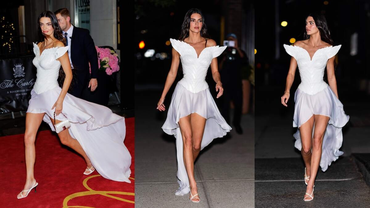 Model Kendall Jenner wears a white angel dress as she walks down a street in Tribeca