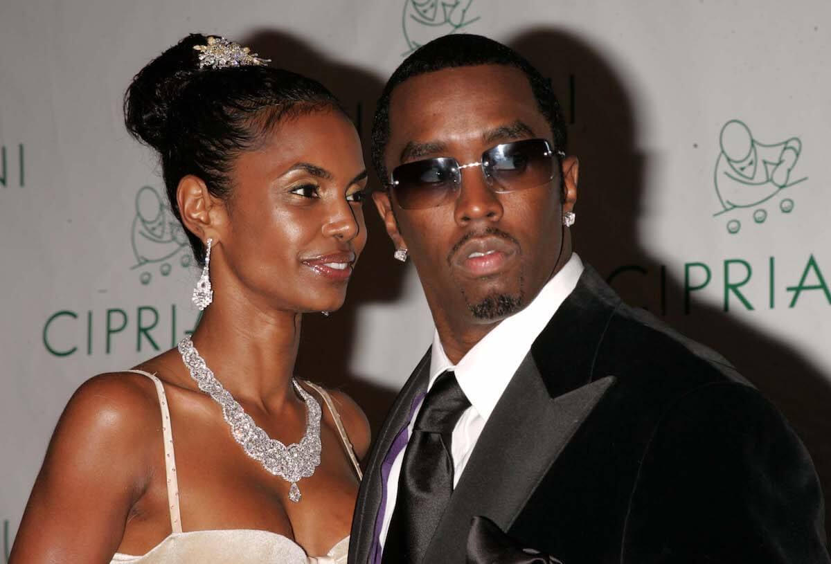 Kim Porter and Sean 'P. Diddy' Combs standing next to each other at an event
