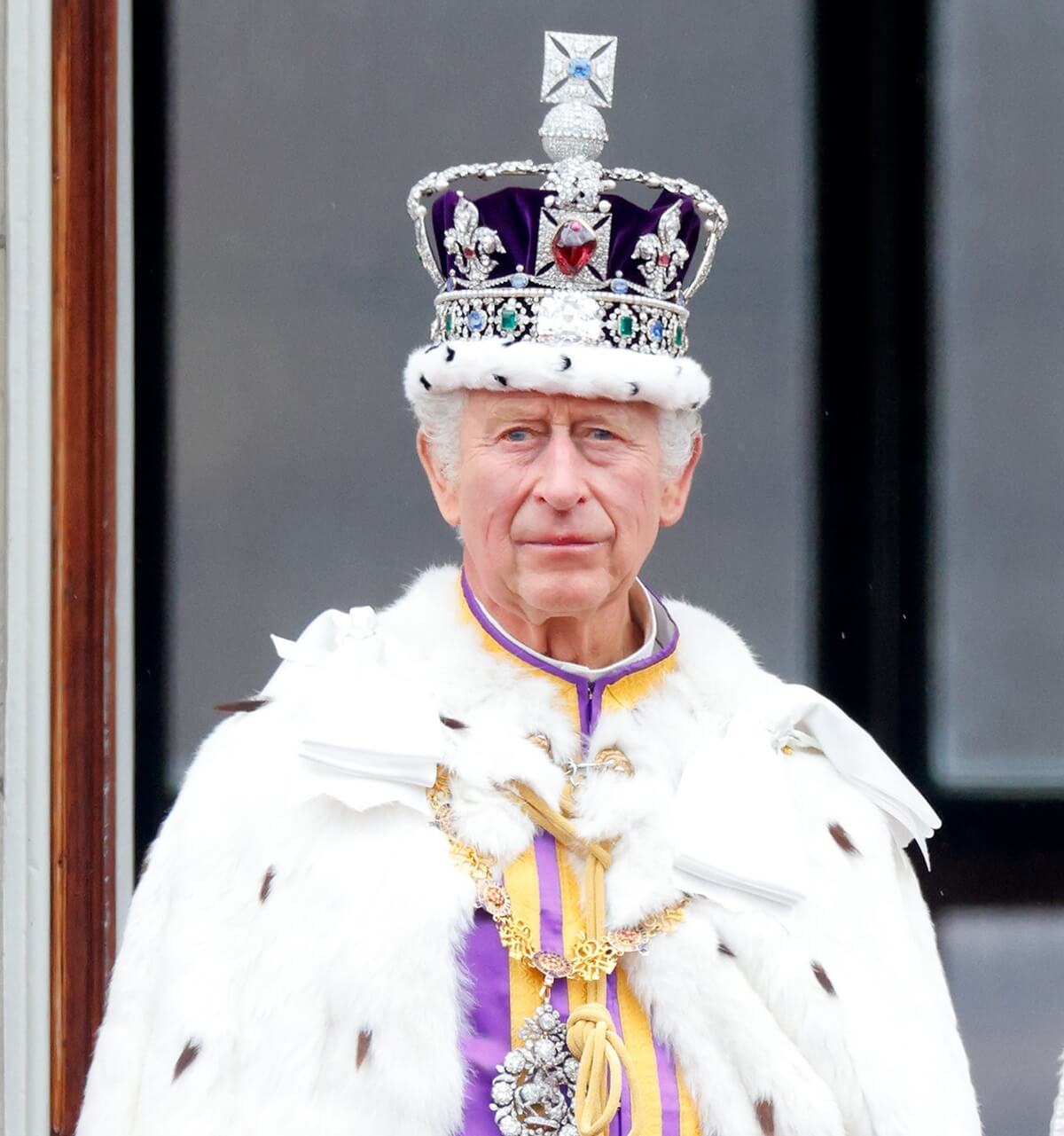 King Charles III watches a flypast from the balcony of Buckingham Palace following his coronation