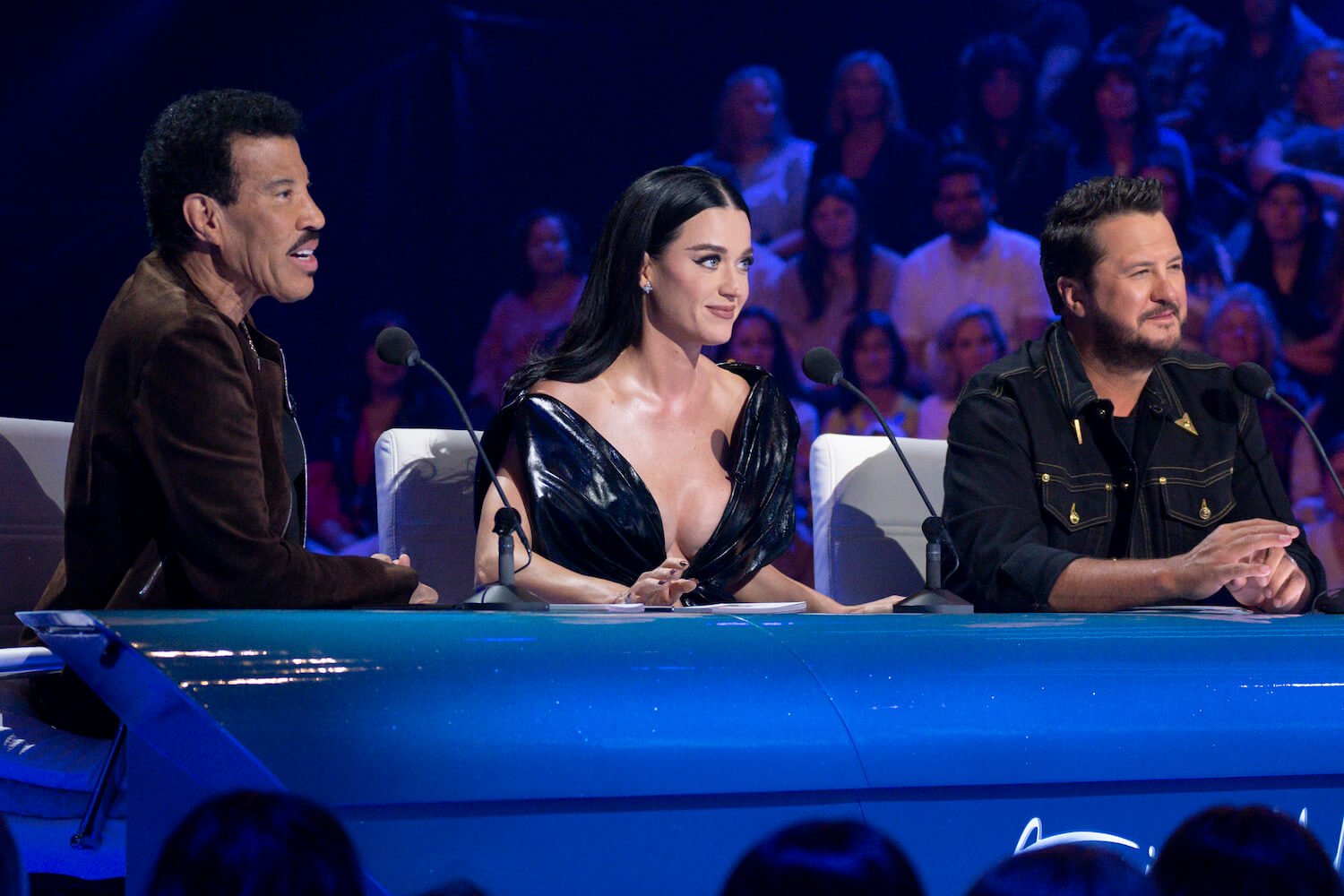 'American Idol' Season 22 judges Lionel Richie, Katy Perry, and Luke Bryan sitting at their table