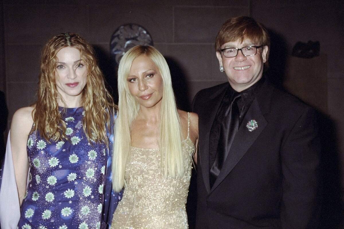 Singer Madonna, Donatella Versace, and Elton John pose together for a photo at the 1997 Meta Gala
