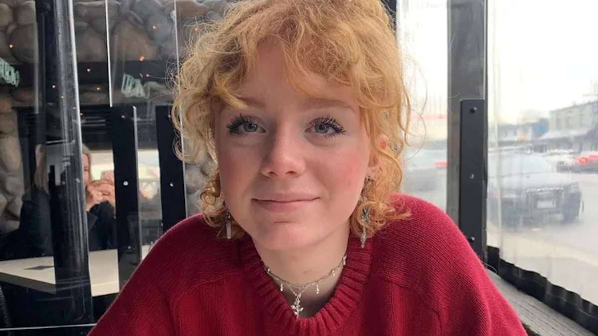 Actor Mamie Laverock in a red sweater