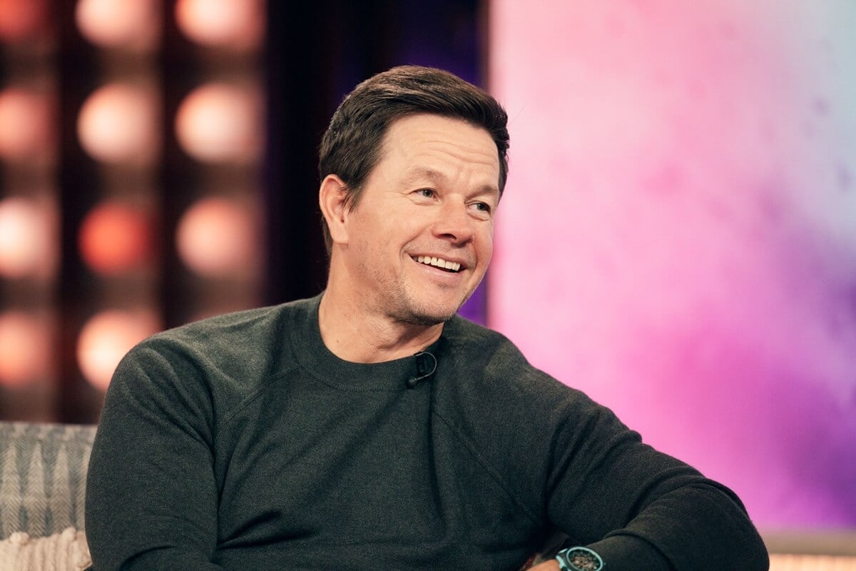 Mark Wahlberg smiling in a black shirt at 'The Kelly Clarkson Show'.