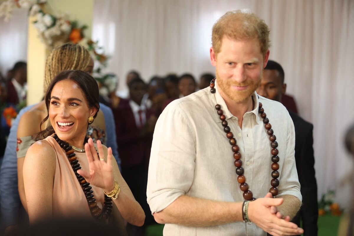 Meghan Markle and Prince Harry arrive at the Lightway Academy in Abuja, Nigeria
