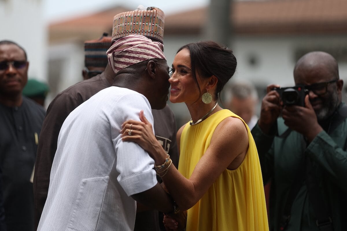 Meghan Markle, wearing a yellow dress in Nigeria