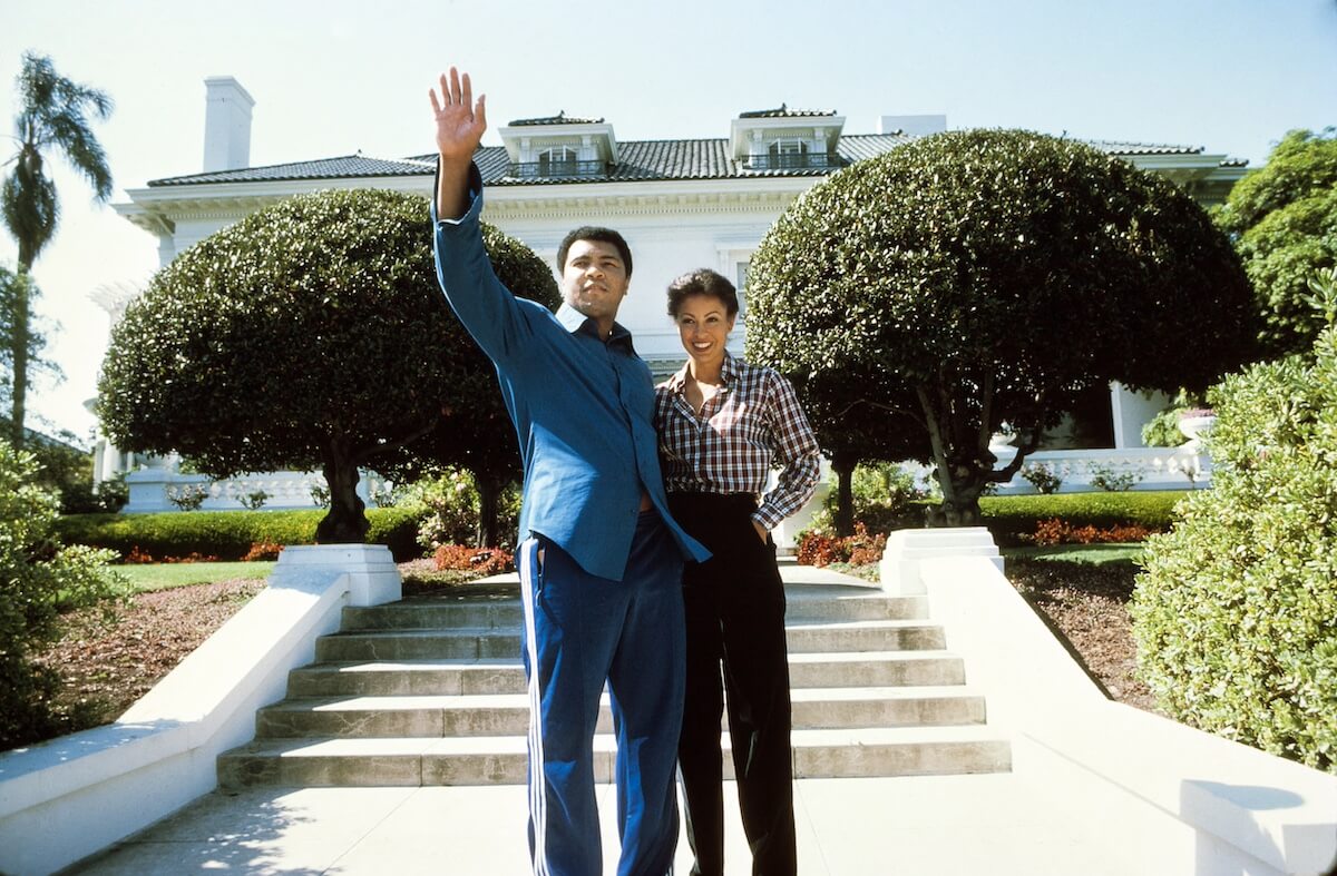 Muhammad Ali and Veronica Ali standing in front of their house in Los Angeles