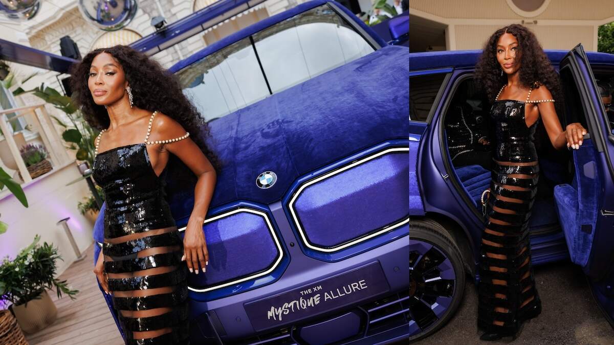 Model Naomi Campbell next to a BMW XM Mystique Allure