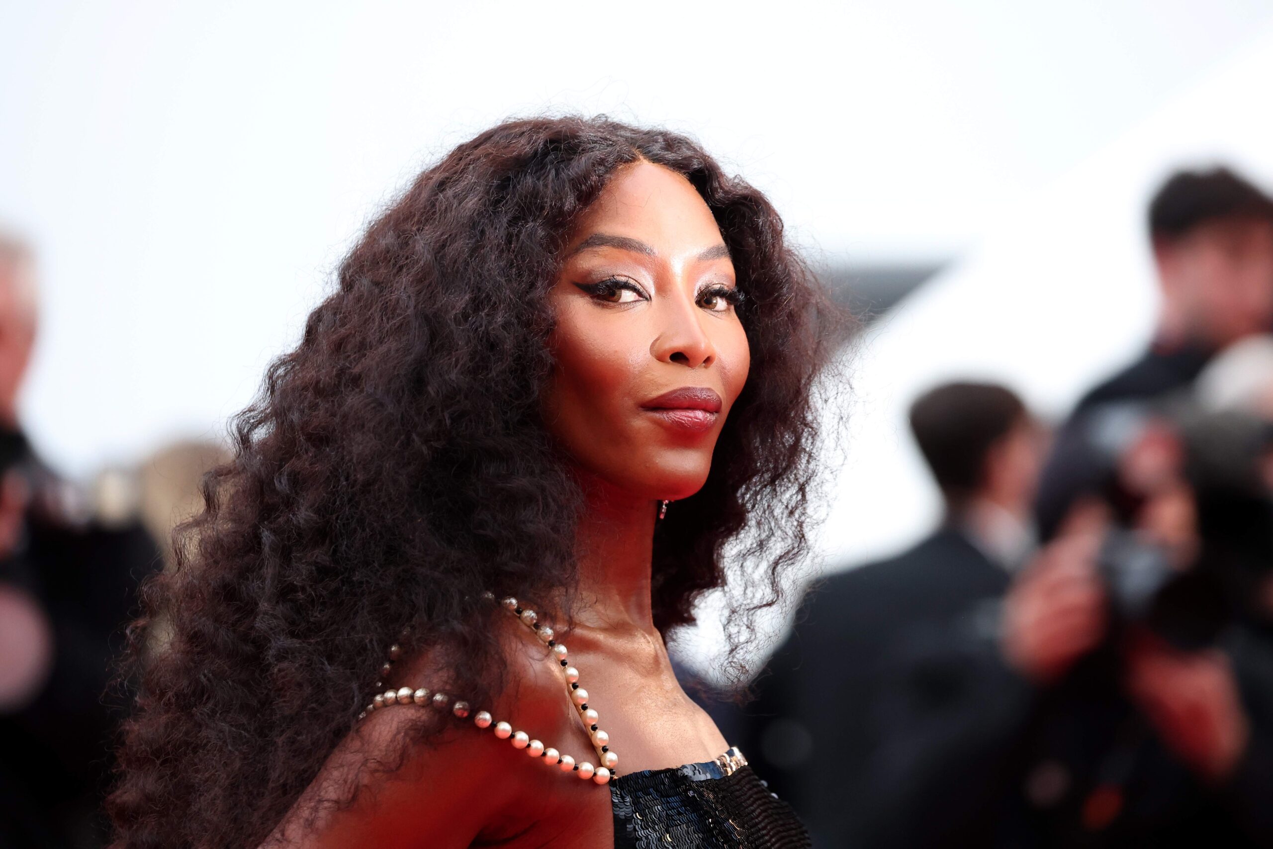 A closeup of Naomi Campbell's face on the red carpet in Cannes
