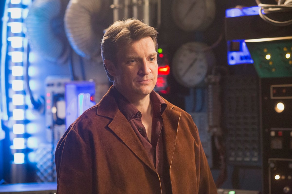 Nathan Fillion in an episode of 'American Housewife' dressed as his 'firefly' character on a fictional set of the tv show.